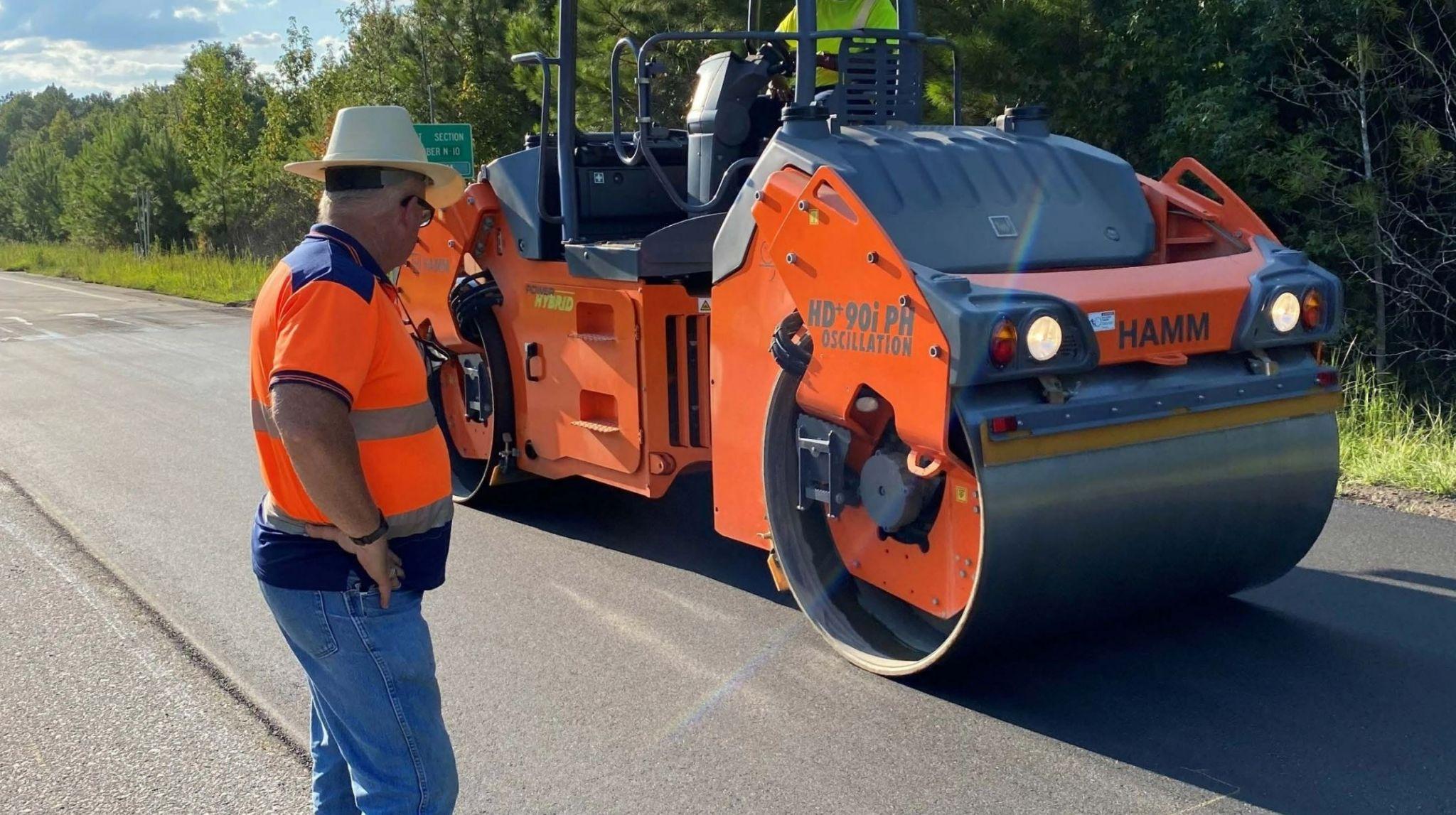 Road paving equipment on a freshly paved roadway.